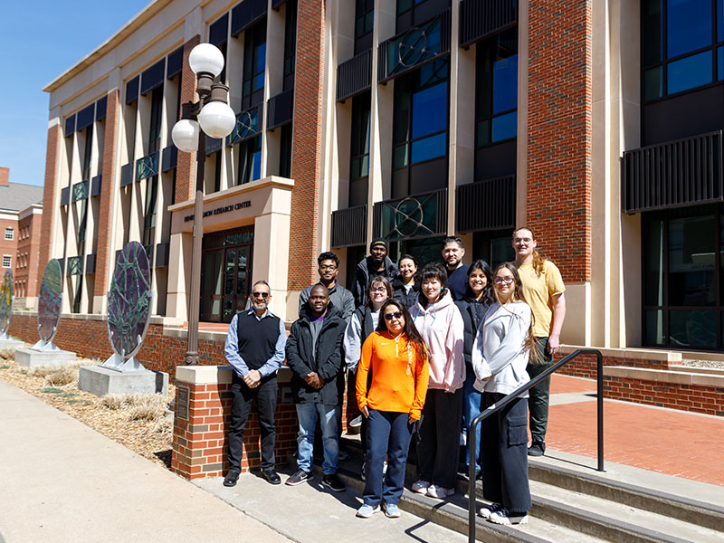 Part of the IBMF team in front of the Henry Bellmon Research Center.